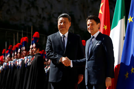 Chinese President Xi Jinping shakes hands with Italian Prime Minister Giuseppe Conte as he arrives at Villa Madama in Rome, Italy March 23, 2019. REUTERS/Yara Nardi