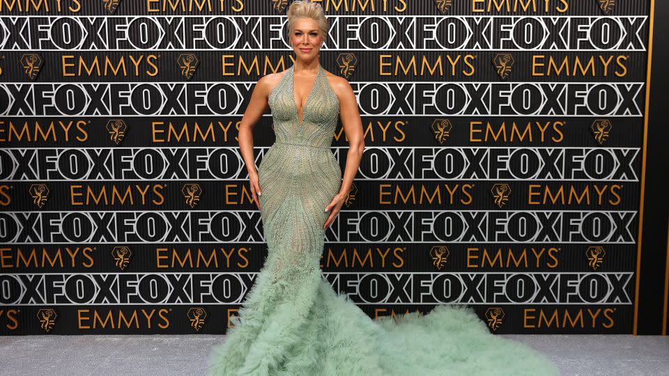 "Ted Lasso" star Hannah Waddingham looked glamorous in a soft mint green beaded Marchesa gown with ruffled tulle train. - Mike Blake/Reuters