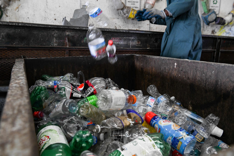 Inmates sort plastic recycling at the Wicomico recycling facility on Tuesday, March 26, 2019. Only plastics numbered one and two can be recycled in the county, because of challenges with the market and contamination, said local officials. 