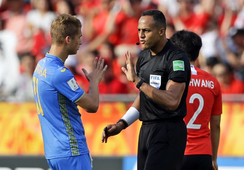 FILE - Referee Ismail Elfath gestures to Ukraine's Vladyslav Supriaha.