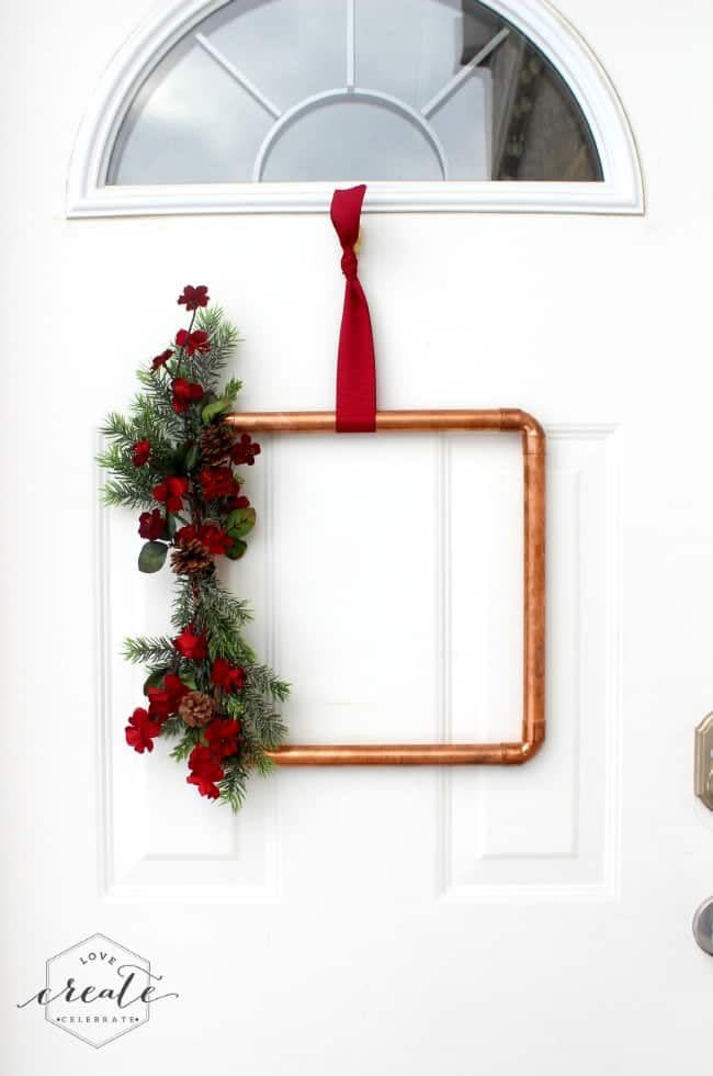<p>Lean into a rustic vibe — and put your DIY skills to the test — with this unique wreath that features copper pipes. Use a silky red ribbon for hanging and watch your creation<em> pop </em>against a white door. </p><p><a class="link " href="https://www.amazon.com/Humphreys-Craft-Double-Ribbon-Polyester/dp/B07PPYKFG7?tag=syn-yahoo-20&ascsubtag=%5Bartid%7C10067.g.42146682%5Bsrc%7Cyahoo-us" rel="nofollow noopener" target="_blank" data-ylk="slk:Shop Now">Shop Now</a></p><p><em><a href="https://lovecreatecelebrate.com/copper-pipe-christmas-wreath/" rel="nofollow noopener" target="_blank" data-ylk="slk:Get the tutorial at Love Create Celebrate »" class="link ">Get the tutorial at Love Create Celebrate »</a></em></p>