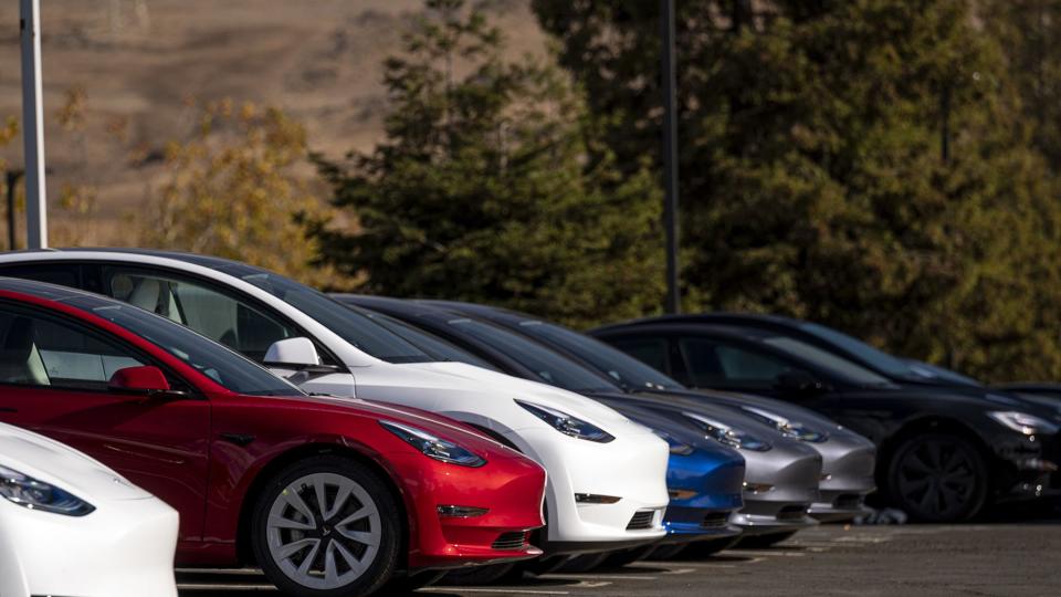 Tesla Vehicles And Charging Stations Ahead Of Earnings Figures
