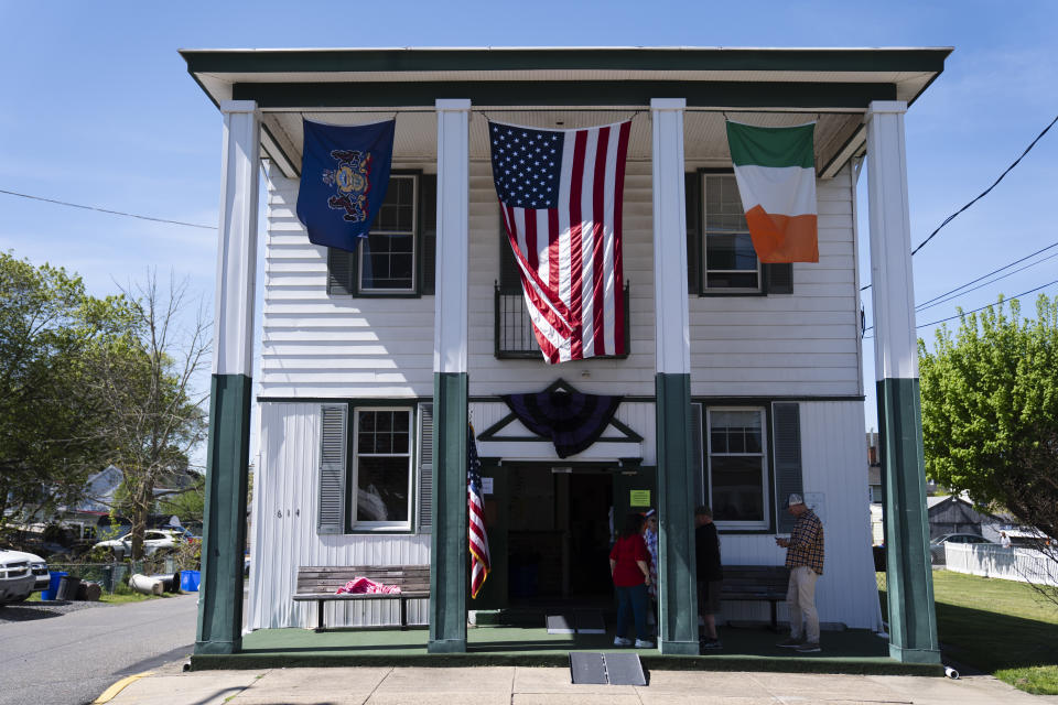 Workers wait for voters at a polling place of in Bristol, Pa., Tuesday, April 23, 2024. (AP Photo/Matt Rourke)