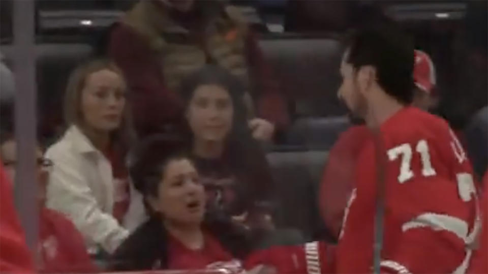 Dylan Larkin knocked over a fan's beer, then made sure to reimburse them. (Photo via Detroit Red Wings/YouTube)