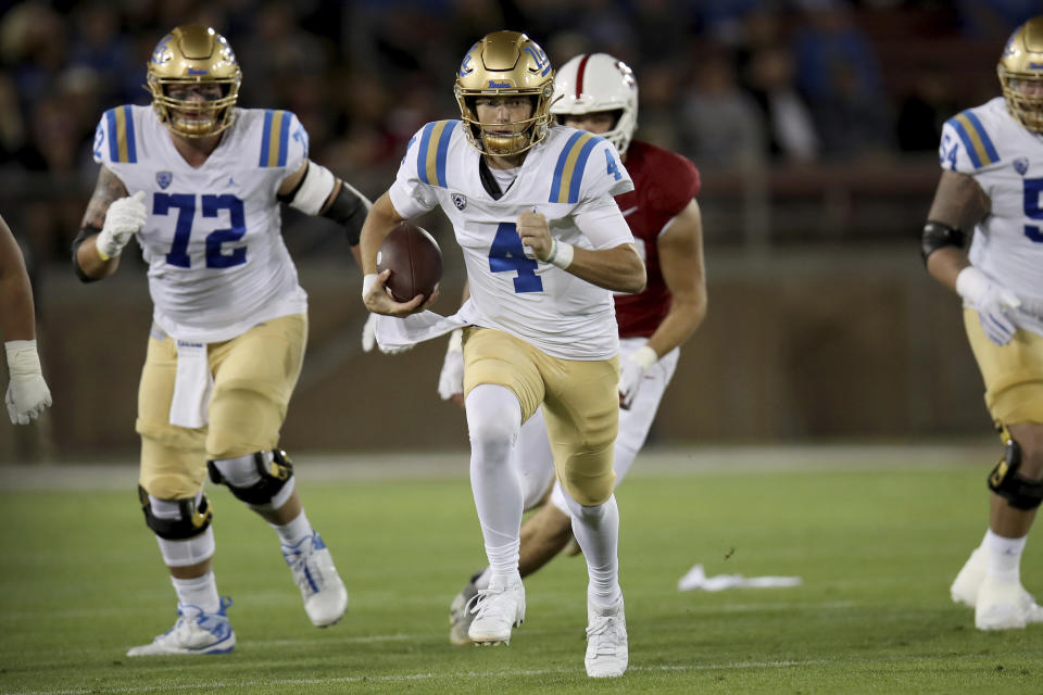 UCLA quarterback Ethan Garbers (4) runs during an NCAA college football game against Stanford, Saturday, Oct. 21, 2023, in Stanford, Calif. (AP Photo/Scot Tucker)