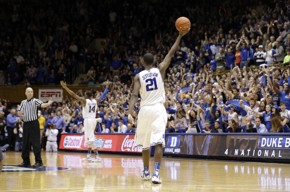 Duke's Amile Jefferson (21) and Rasheed Sulaimon (14) celebrate near the end of an NCAA college basketball game against Maryland in Durham, N.C., Saturday, Feb. 15, 2014. Duke won 69-67. (AP Photo/Gerry Broome)