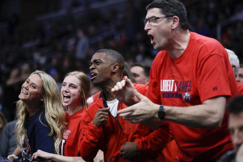 Liberty fans cheer during the second half of the team's first-round game against Mississippi State in the NCAA men's college basketball tournament Friday, March 22, 2019, in San Jose, Calif. (AP Photo/Ben Margot)