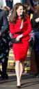 <p>During a Place2Be event, Kate wears a red peplum Luisa Spagnoli suit accented with a black velvet bow and black buttons.</p>
