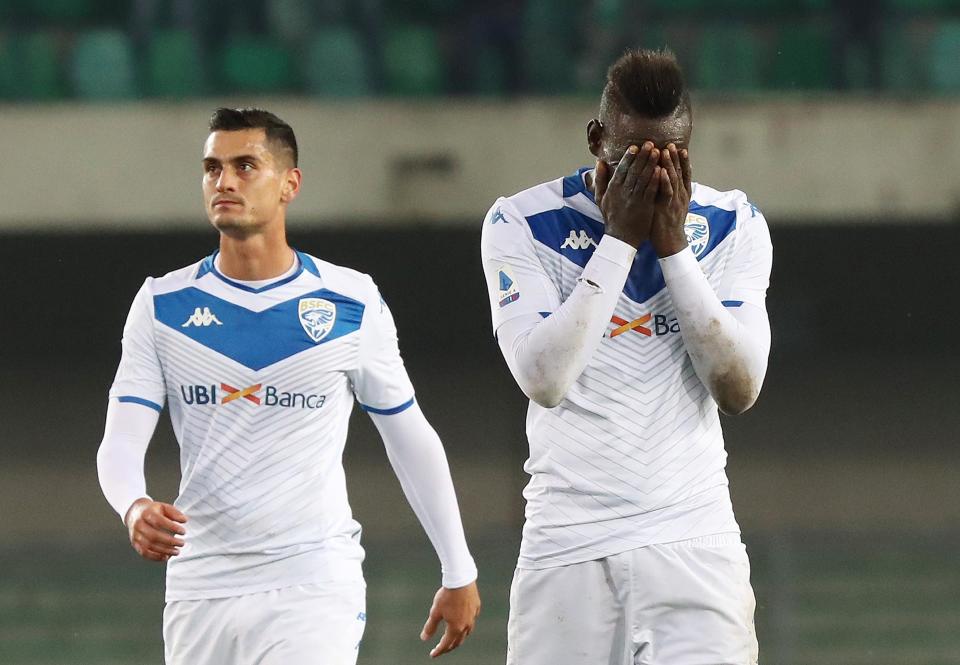 Brescia's Mario Balotelli, right, reacts at the end of the Italian Serie A soccer match between Verona and Brescia at the Bentegodi stadium in Verona, Italy, Sunday, Nov. 3, 2019. Verona supporters' racist chants upset the Italian bomber who also scored one goal. (Simone Venezia/ANSA via AP)