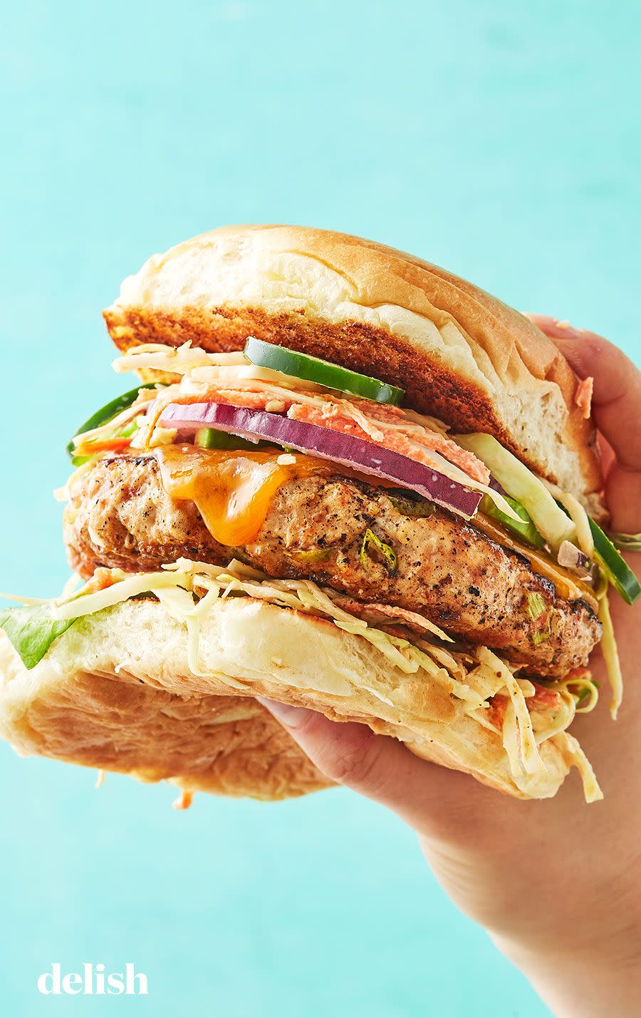 <p>Toss some chicken burgers on the grill while you're at it!</p><p>Get the recipe from <a href="https://www.delish.com/cooking/recipe-ideas/recipes/a13513/chicken-burgers-recipe-mslo1010/" rel="nofollow noopener" target="_blank" data-ylk="slk:Delish.;elm:context_link;itc:0;sec:content-canvas" class="link ">Delish.</a> </p>