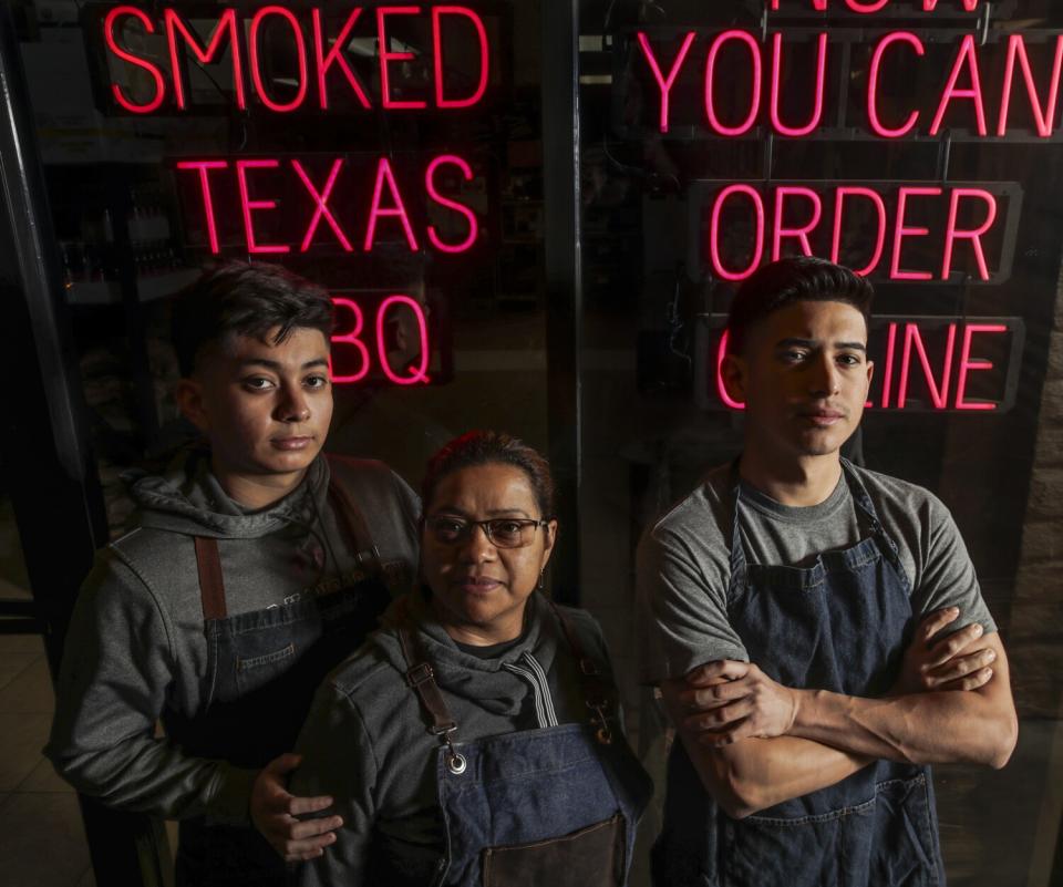 A portrait of Raul, Anabell and Sebastian Ramirez standing outside the family's Huntington Park restaurant.