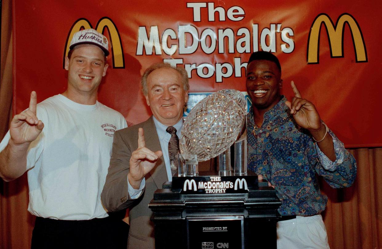 University of Washington coach Don James, center, quarterback Billy Joe Hobert, left, and Beno Bryant, right, all agree they're No.1 as they accept the McDonald's Trophy in Anaheim, Calif., Jan. 2, 1992. They were chosen No.1 in the USA Today-CNN coaches poll.