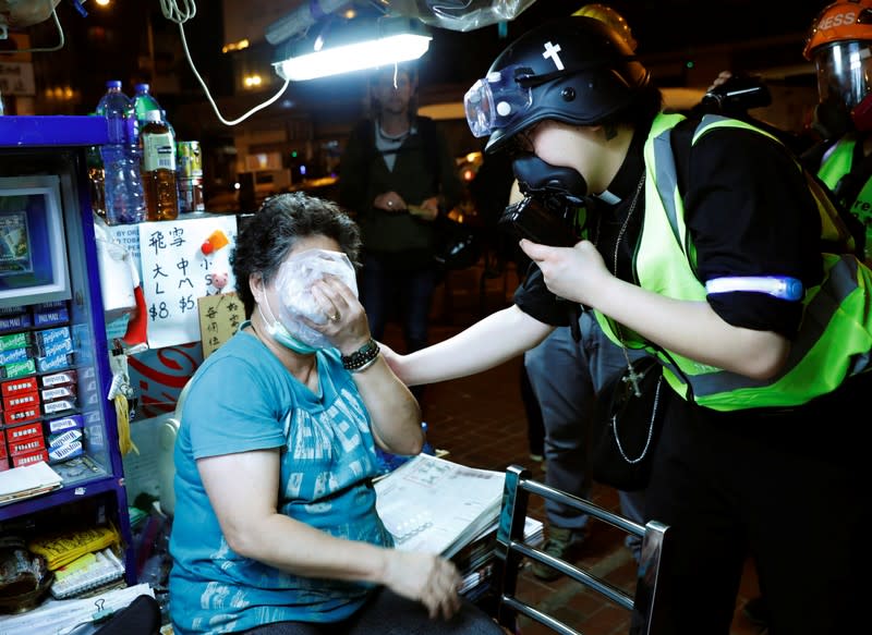 The Wider Image: Sermons with saline: Hong Kong pastor offers aid and prayers