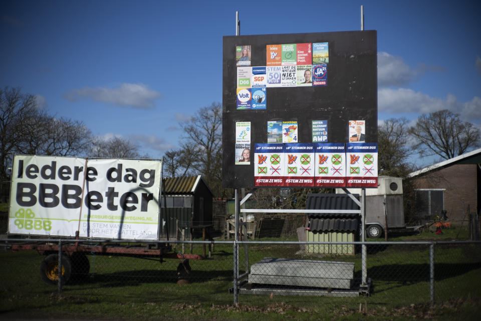 Posters of political parties for the provincial elections, with one of the Farmer Citizen Movement BBB, left, are seen at a farm in Okkenbroek, eastern Netherlands, Wednesday, March 15, 2023. Local elections with national consequences opened Wednesday in the Netherlands as voters cast their ballots for the country's 12 provincial legislatures, which in turn elect the national parliament's upper house. (AP Photo/Peter Dejong)