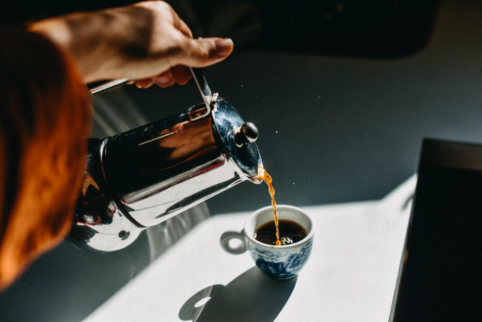 Woman pouring coffee from a pot