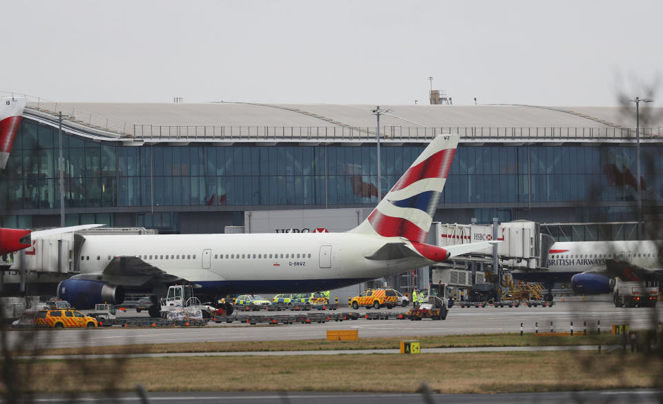 Police and airside operations vehicles at Heathrow Airport (Steve Parsons/PA Wire)