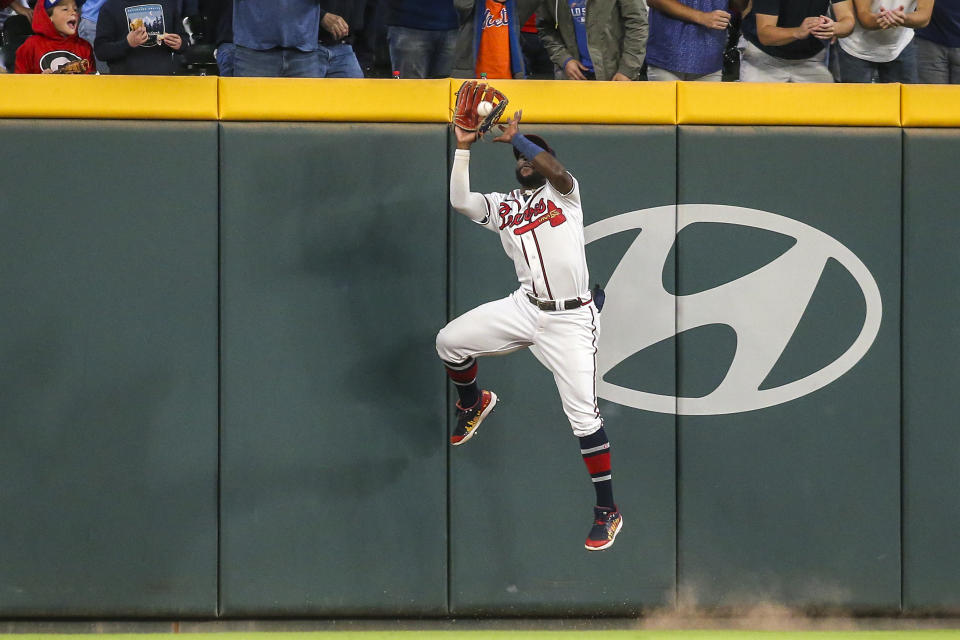Atlanta Braves center fielder Michael Harris II makes a catch at the wall on a ball hit by New York Mets' Brandon Nimmo during the third inning of a baseball game Saturday, Oct. 1, 2022, in Atlanta. (AP Photo/Brett Davis)