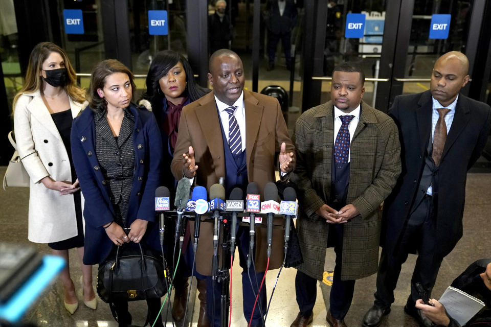 Actor Jussie Smollett's defense attorney Nenye Uche, center, flanked by his legal team, talks to reporters in the Leighton Criminal Courthouse lobby Thursday, Dec. 9, 2021, in Chicago, after a jury found Smollett guilty on five of six charges he staged a racist, anti-gay attack on himself and lied to police about it. (AP Photo/Charles Rex Arbogast)