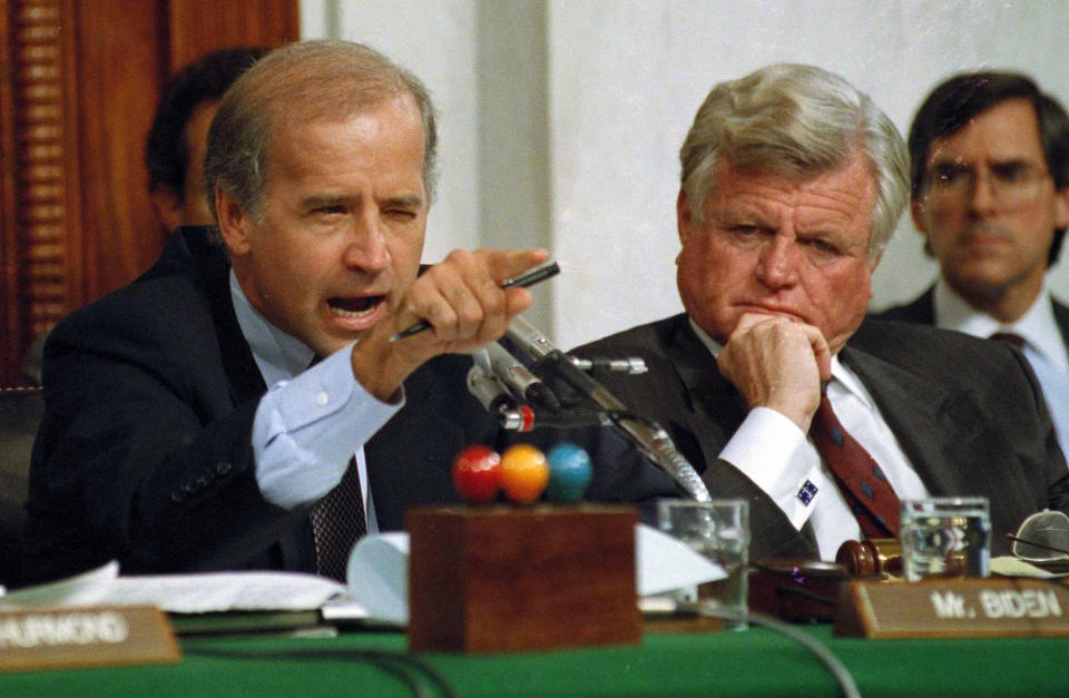 FILE - In this Oct. 12, 1991, file photo, then-Senate Judiciary Committee Chairman Sen. Joe Biden, D-Del., points angrily at Clarence Thomas during comments at the end of hearings on Thomas' nomination to the Supreme Court on Capitol Hill. Sen. Edward Kennedy, D-Mass., watches at right. Biden has won the last few delegates he needed to clinch the Democratic nomination for president. (AP Photo/Greg Gibson, File)