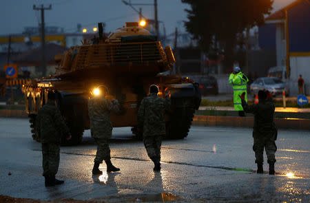 A Turkish military convoy arrives at an army base in the border town of Reyhanli near the Turkish-Syrian border in Hatay province, Turkey January 17, 2018. REUTERS/Osman Orsal