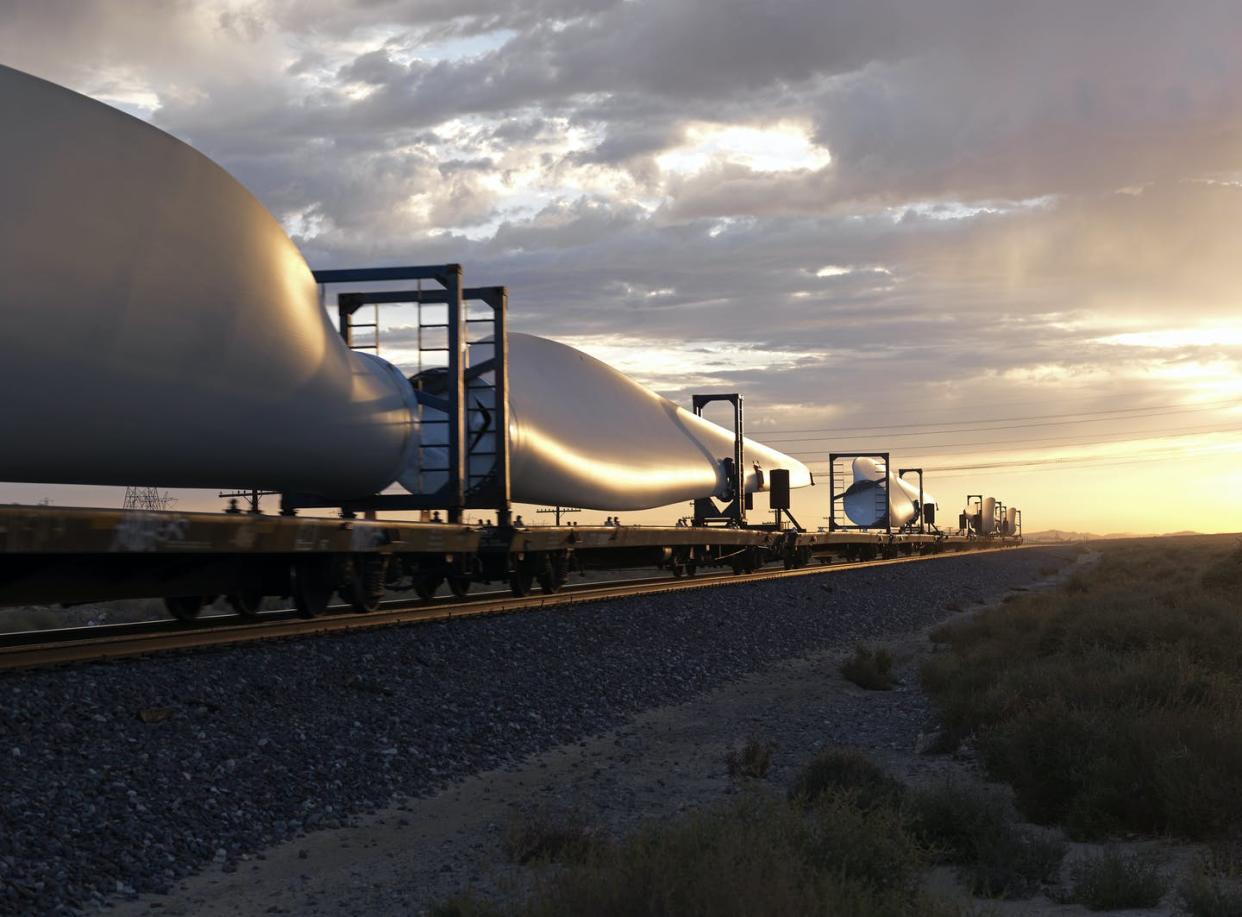 <span class="caption">Government policies sparked rapid growth and technology innovation in solar energy, wind energy and battery markets.</span> <span class="attribution"><a class="link " href="https://www.gettyimages.com/detail/photo/wind-turbine-blades-on-train-royalty-free-image/108124621?adppopup=true" rel="nofollow noopener" target="_blank" data-ylk="slk:Michael Hall/Getty Images;elm:context_link;itc:0;sec:content-canvas">Michael Hall/Getty Images</a></span>