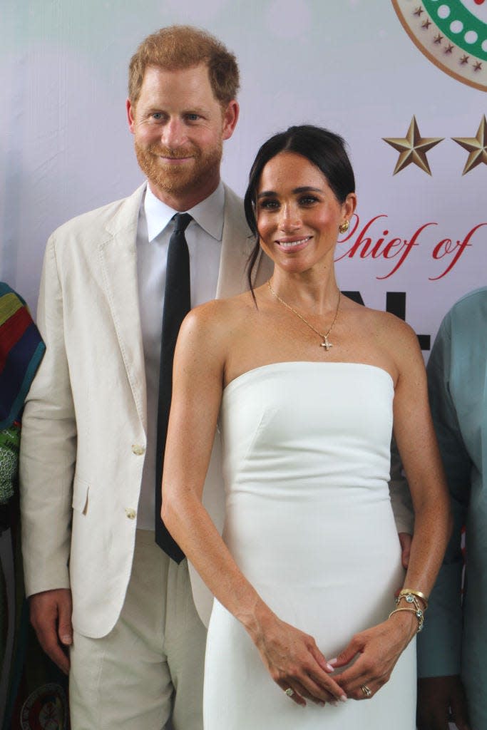 prince harry, duke of sussex, and meghan, duchess of sussex, pose for a photo