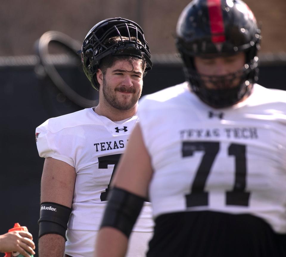 Texas Tech sophomore Sheridan Wilson, left, is competing with Caleb Rogers and newcomer Davion Carter to start at center. Vinny Sciury (71), a first-team all-conference honoree at Toledo, is projected to start at left guard.