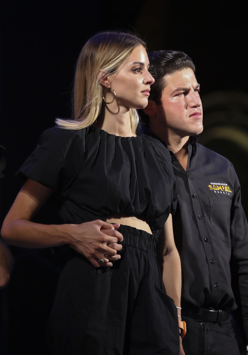 YouTuber Mariana Rodríguez and Samuel Garcia, the newly-elected governor of Nuevo Leon, attend their victory celebration at the Macroplaza of Monterrey, in Nuevo Leon state, Mexico, Monday, June 7, 2021. The apparent winner of the race, Samuel Garcia, 33, is a baby-faced former senator whose blond wife, YouTuber Mariana Rodríguez, is better known for posting videos of herself giving makeup tutorials or clutching a small dog. (AP Photo/Roberto Martinez)