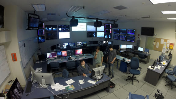 The control room at the LIGO Observatory, Livingston, Louisiana. Seen are senior research scientist Valery Frolov, filmmaker Kai Staats, and audio engineer Joe Chilcott.