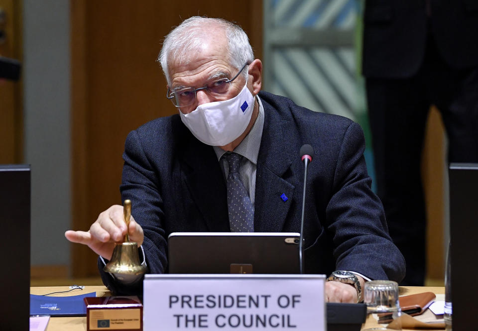 European Union foreign policy chief Josep Borrell rings a bell to signal the start of a EU Foreign Affairs Minister meeting at the European Council building in Brussels, Monday, Jan. 25, 2021. EU Foreign Ministers were debating Monday the bloc's response to the arrest of Russian opposition leader Alexei Navalny and a weekend police crackdown that saw thousands taken into custody during protests in support of President Vladimir Putin's most well-known critic. (John Thys/Pool Photo via AP)