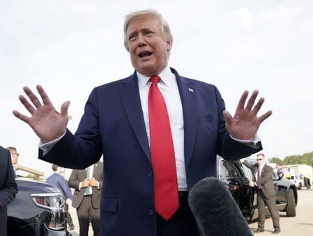 FILE PHOTO: U.S. President Donald Trump speaks to reporters after arriving at Pitt-Greenville Airport in Greenville