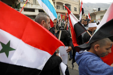 Druze people take part in a rally over U.S. President Donald Trump's support for Israeli sovereignty over the Golan Heights, in Majdal Shams near the ceasefire line between Israel and Syria in the Israeli occupied Golan Heights March 23, 2019 REUTERS/Ammar Awad