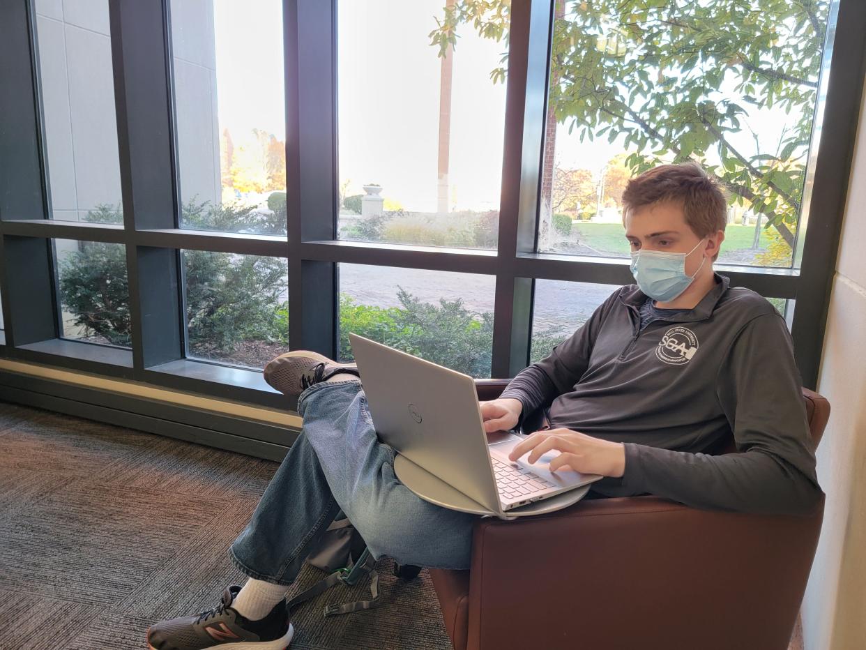 Ball State freshman Andrew Hopkins works on homework in the lobby of the David Letterman Communication and Media Building at Ball State University. The building was the first of 16 LEED certified buildings on Ball State’s campus, beginning the University’s mission of architectural sustainability.