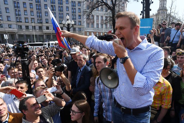 <p>KIRILL KUDRYAVTSEV/AFP via Getty</p> Russian opposition leader Alexei Navalny addresses supporters during an unauthorized anti-Putin rally on May 5, 2018, in Moscow