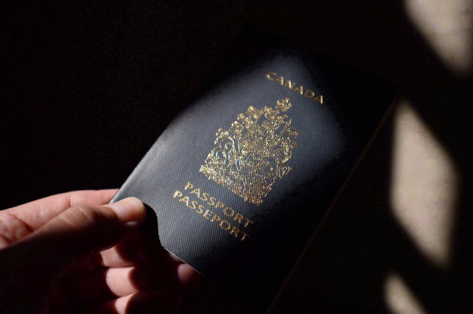 A Canadian passport is displayed in Ottawa on Thursday, July 23, 2015. The European Union's top court says in an advisory opinion that a deal between the EU and Canada on sharing airline passenger data breaches citizens' privacy and cannot be concluded in its current form. THE CANADIAN PRESS/Sean Kilpatrick