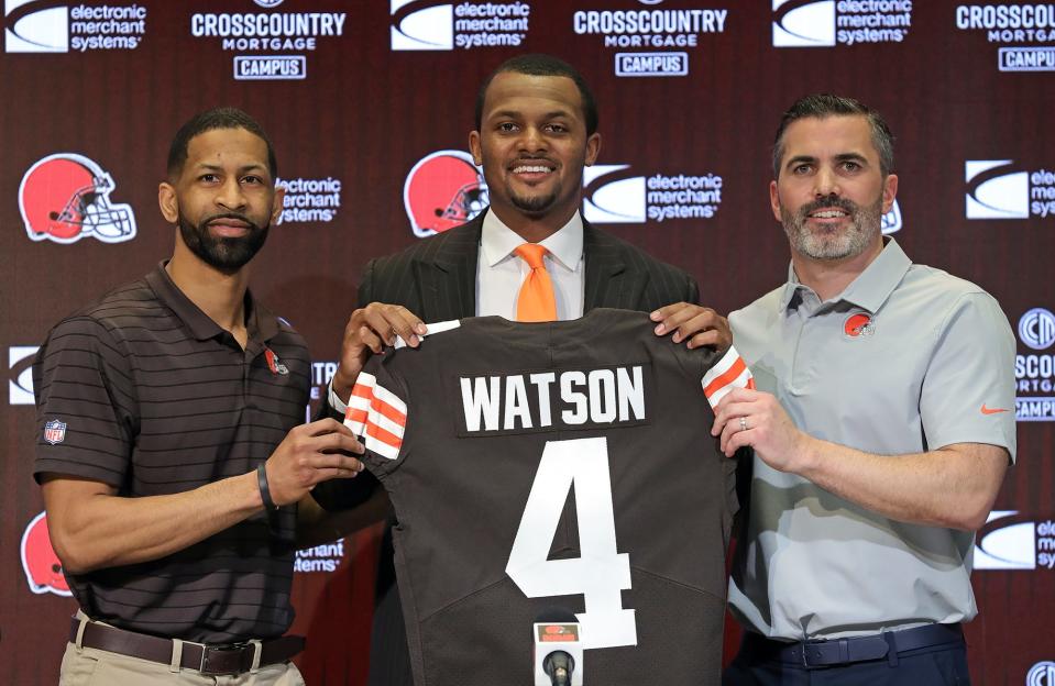 Cleveland Browns quarterback Deshaun Watson, center, poses for a portrait with general manager Andrew Berry, left, and coach Kevin Stefanski during Watson's introductory press conference March 25, 2022, in Berea.