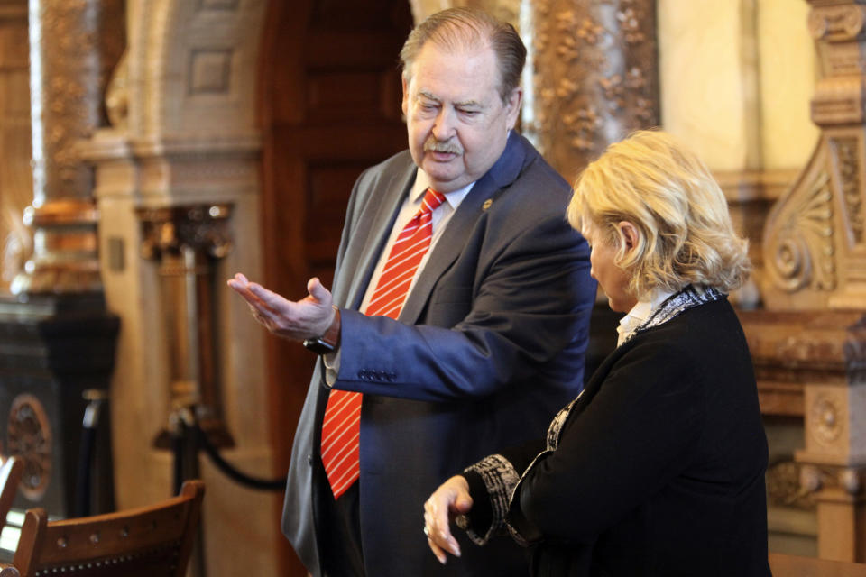 Kansas state Sen. Tim Shallenburger, left, R-Baxter Springs, consults with Senate tax committee Chair Caryn Tyson, R-Parker, during the Senate's debate on a $19 billion spending bill, Friday, April 5, 2024, at the Statehouse in Topeka, Kan. Both Shallenburger and Tyson oppose the bill, though it has passed and gone to Democratic Gov. Laura Kelly. (AP Photo/John Hanna)