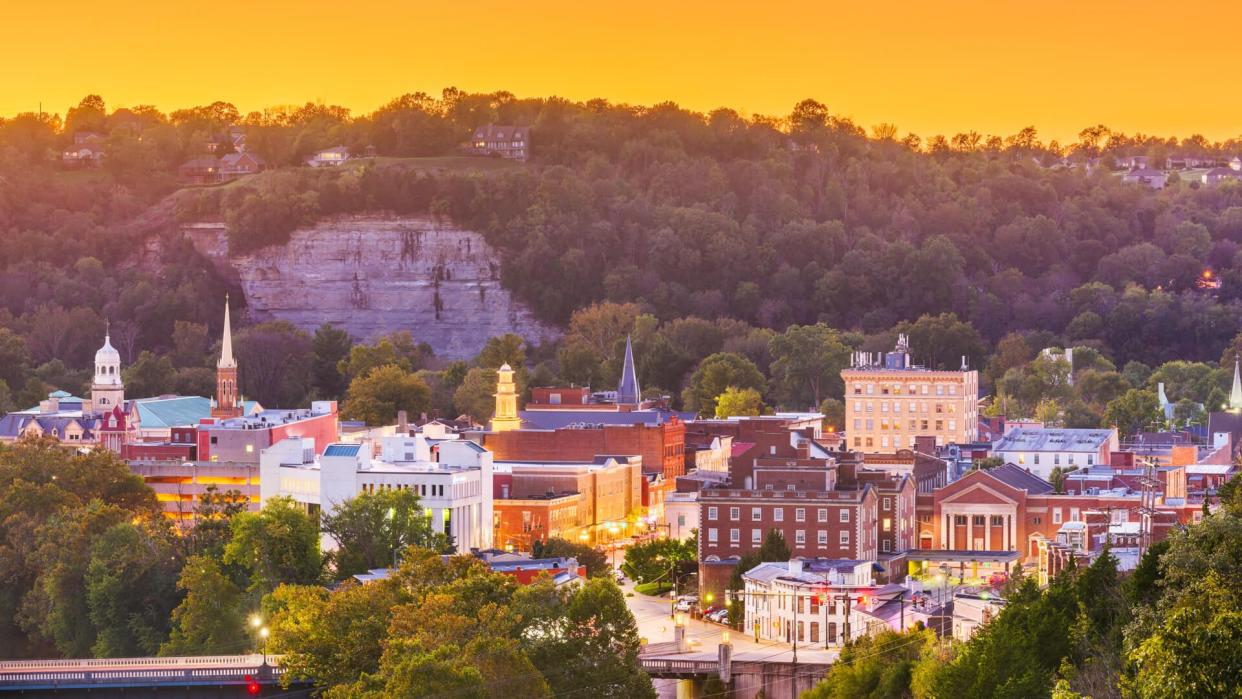 Frankfort, Kentucky, USA town skyline on the Kentucky River at dusk.