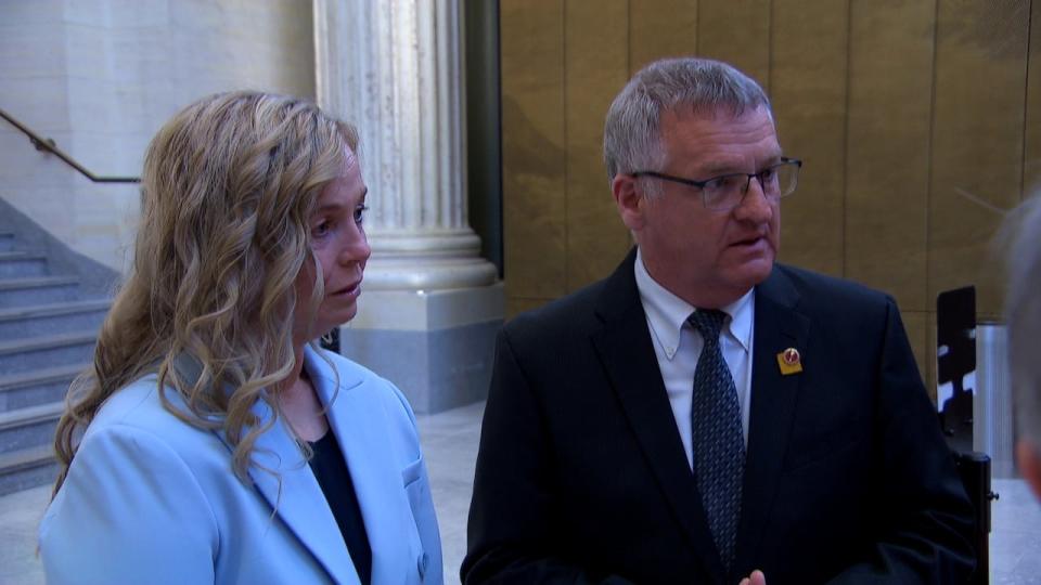 McGrath and Fabian Manning speak with senators in Ottawa on April 11, ahead of McGrath's speech to the Senate's committee on social affairs, science and technology. 