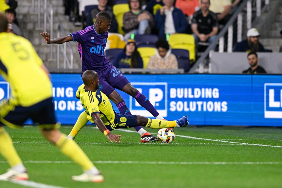 Midfielder Djibril Diani, here getting tackled by Nashville SC midfielder Brian Anunga, and Charlotte FC are off to a 2-2-1 start this season.