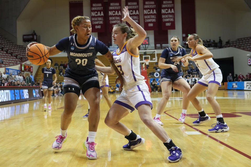 Monmouth guard Jania Hall, left, moves the ball against the defense of Tennessee Tech guard Ansley Hall during the first half of a First Four college basketball game in the NCAA women's Basketball Tournament in Bloomington, Ind., Thursday, March 16, 2023. (AP Photo/AJ Mast)