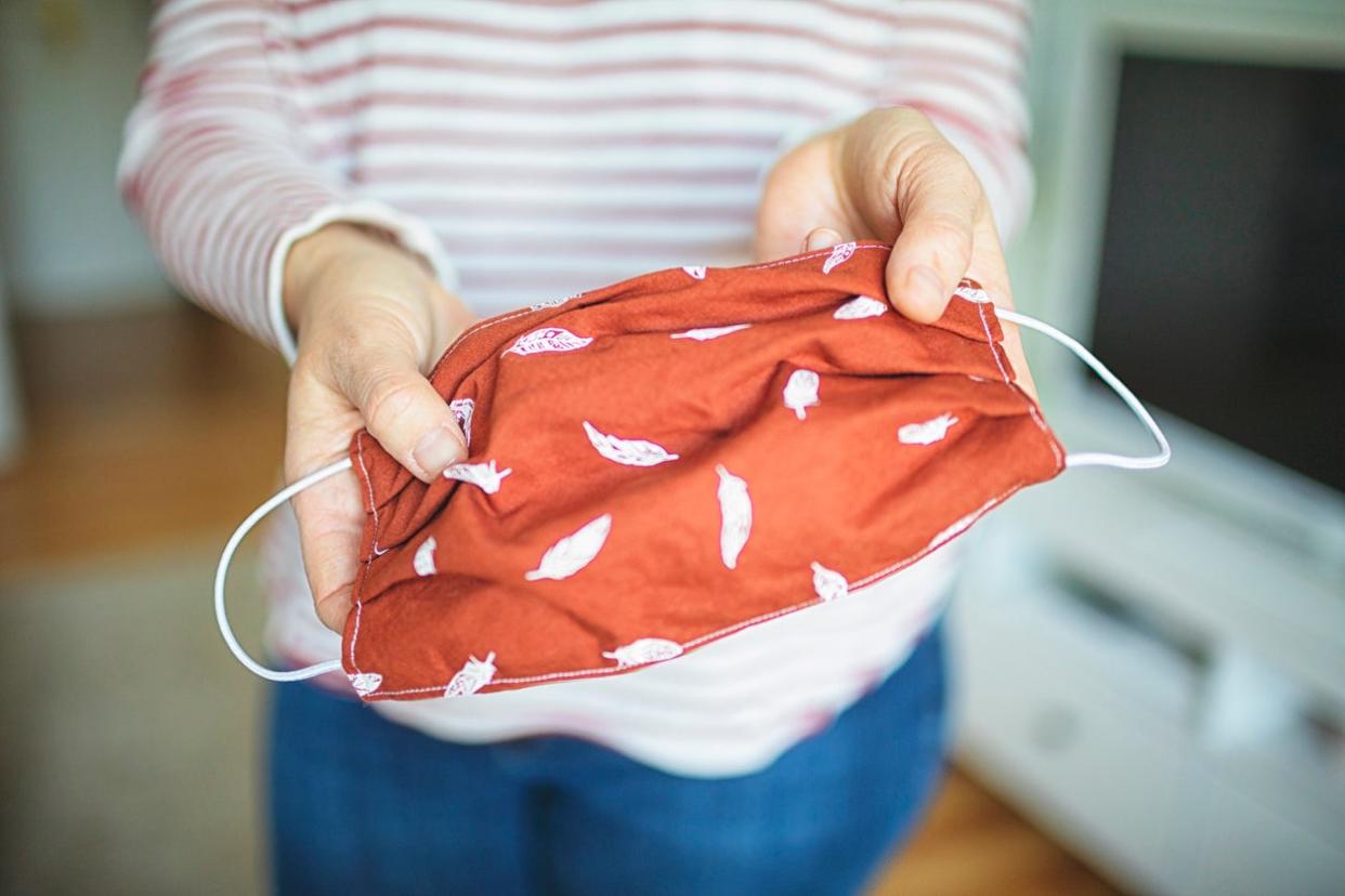 A Ryanair passenger claims she was told to wear another passenger’s used surgical mask over her own cloth one (Getty Images/iStockphoto)