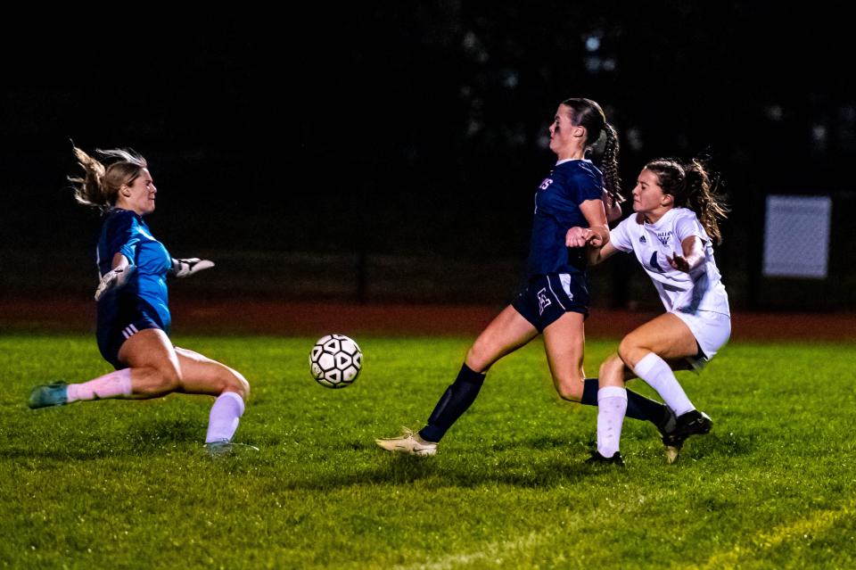 Apponequet's Cecelia Levrault breaks in on Archbishop Williams.