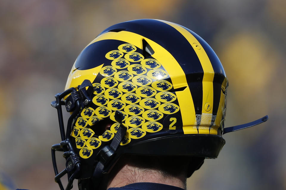 Michigan quarterback Shea Patterson's helmet is shown in the first half of an NCAA college football game against Michigan State in Ann Arbor, Mich., Saturday, Nov. 16, 2019. (AP Photo/Paul Sancya)