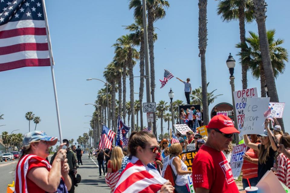 Protesters gather in a demonstration against Gov. Gavin Newsom on May 01, 2020 in Huntington Beach, California. (Photo by Apu Gomes/Getty Images)