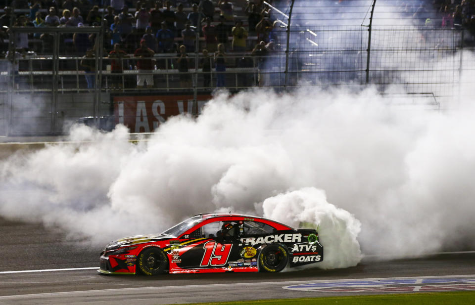 Martin Truex Jr. (19) does a burnout after winning a NASCAR Cup Series auto race at the Las Vegas Motor Speedway on Sunday, Sept. 15, 2019. (AP Photo/Chase Stevens)