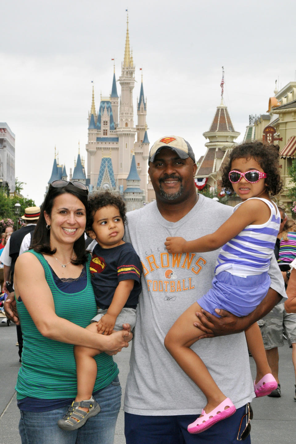 This June 2013 photo provided by Disney PhotoPass Service shows Creed Anthony of Indianapolis with his daughter Sophie, 5, son Isaac, 2, and wife Amal, on a visit to Disney World’s Magic Kingdom in Lake Buena Vista, Fla. Anthony is an example of a new generation of hands-on dads who don’t just change the occasional diaper but who view “parenting as a partnership,” as he put it, by being as involved in childrearing as moms. (AP Photo/Disney PhotoPass Service)