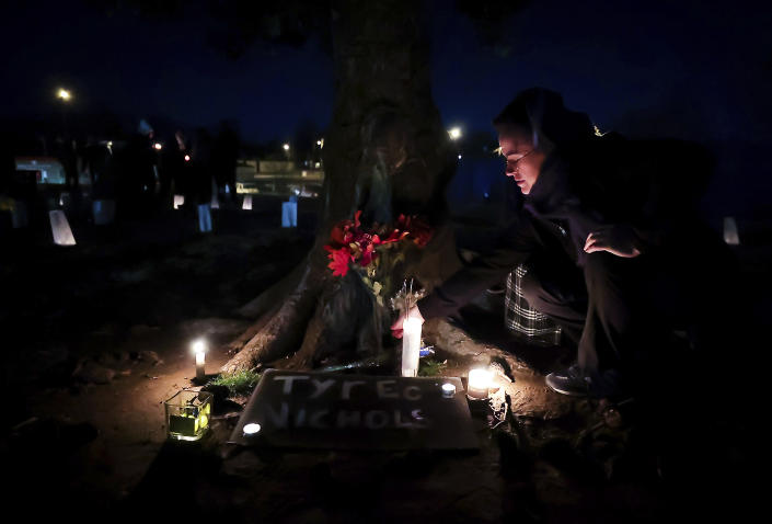 People attend a candlelight vigil for Tyre Nichols, who died after being beaten by Memphis police officers, in Memphis, Tenn., Thursday, Jan. 26, 2023. (Patrick Lantrip/Daily Memphian via AP)