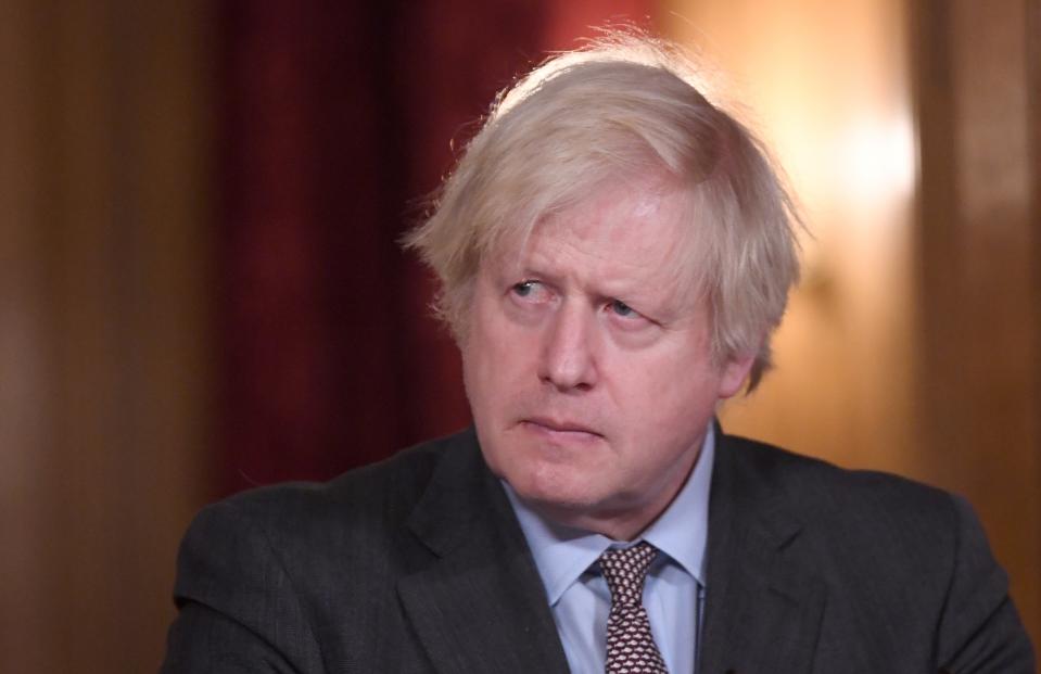 Britain's Prime Minister Boris Johnson attends a virtual press conference inside 10 Downing Street in central London on February 3, 2021, to give an update on the coronavirus covid-19 pandemic. - Britain on Wednesday seized on a new study that said the Oxford/AstraZeneca Covid vaccine significantly reduces virus transmission and is highly protective after a single dose, after stinging criticism about its effectiveness from EU leaders. (Photo by Stefan Rousseau / POOL / AFP) (Photo by STEFAN ROUSSEAU/POOL/AFP via Getty Images)