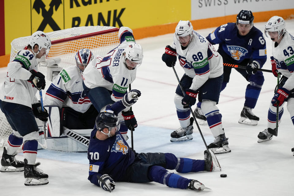 Finland's Teemu Hartikanen falls to the ice during a match between Finland and the the United States in the semifinals of the Hockey World Championships, in Tampere, Finland, Saturday, May 28, 2022. (AP Photo/Martin Meissner)